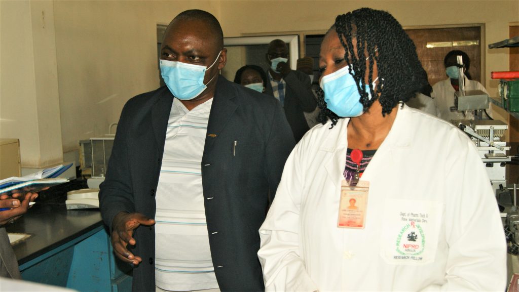 Prof Martins Emeje with Assoc Prof C Y Isimi highlighting activities taking place in their laboratory